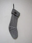 Black And White Stripped Zig Zag Knit Christmas Stocking 20" By 9". Fixed Price $16.99.