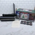 Mr. Christmas Outdoor Holiday Projector 25 Slides For Every Season 1999. Fixed Price $34.99.