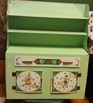 Lrg Retro Doll Cabinet Metal Green With Floral Theme Decoration. Fixed Price $35.00.