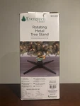 Evergreen Classics Rotating Electric Metal Christmas Tree Stand Complete Box. Fixed Price $30.49.