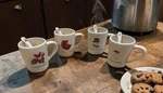 Oneida 2009 Macy Set Of Four Mugs With Spoons Never Used In Box. Fixed Price $24.99.