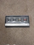 Set Of 4 Christmas Shot Glasses From Threshold, Noel, Joy, Merry, Cheer. Fixed Price $18.00.