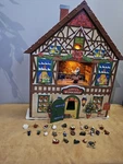 Mr. Christmas Santas Workshop House Animated Musical Advent Calendar Ornaments. Fixed Price $120.00.