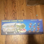 Joyin Dinosaur Carrier Truck Toy Set W/ Mini Cars, Lights & Sounds. Fixed Price $15.99.